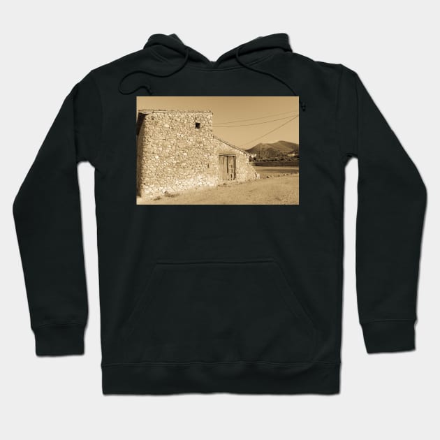 Old stone building with dilapidated wooden doors Hoodie by brians101